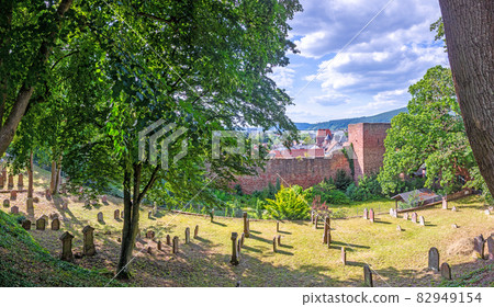 View on the old jewish cemetery and city wall of the medieval city of Miltenberg in Germany during daytime View on the old jewish cemetery and city wall of the medieval city of Miltenberg in Germany during daytime 82949154