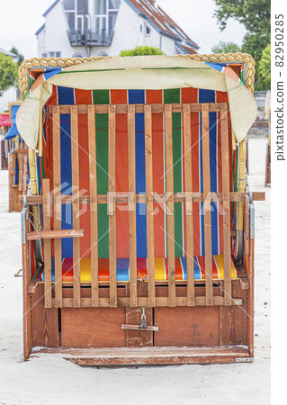 Close up picture of old traditional roof wicker beach chair in Germany Close up picture of old traditional roof wicker beach chair in Germany 82950285