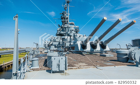 Close up pictures of old WW2 battleship during daytime Close up pictures of old WW2 battleship during daytime 82950332