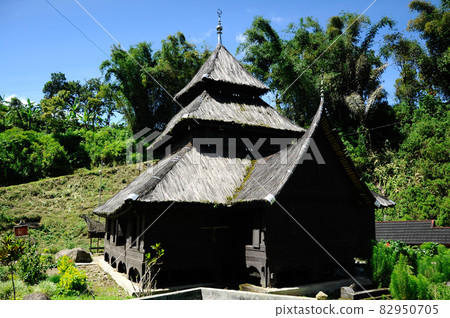 WEST SUMATERA, INDONESIA -JUNE 8, 2014: Tuo Kayu Jao Mosque is located in West Sumatra, Indonesia. Built in 1599 and is the second oldest mosque in Indonesia. WEST SUMATERA, INDONESIA -JUNE 8, 2014: Tuo Kayu Jao Mosque is located in West Sumatra, Indonesia. Built in 1599 and is the second oldest mosque in Indonesia. 82950705
