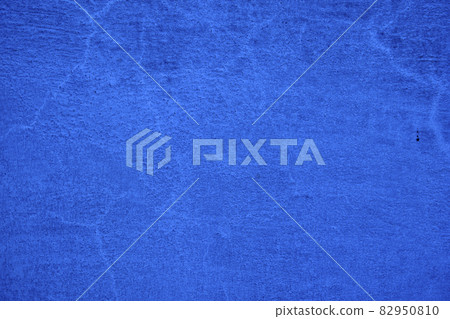 Blue background of a rough painted wall Blue background of a rough painted wall 82950810
