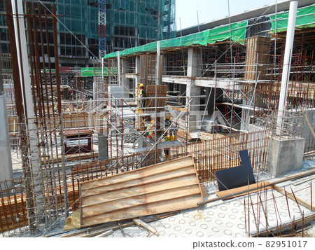 MALACCA, MALAYSIA -MAY 30, 2016: Construction site in progress at MALACCA, Malaysia during daytime. Workers busy with their task such as installing timber form work and reinforcement bar. MALACCA, MALAYSIA -MAY 30, 2016: Construction site in progress at MALACCA, Malaysia during daytime. Workers busy with their task such as installing timber form work and reinforcement bar. 82951017