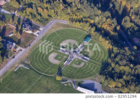 Aerial view of Baseball Fields during a sunny fall season evening. 82951294