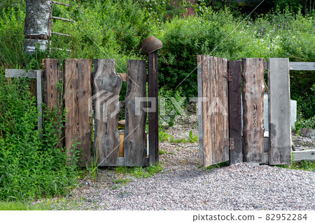 Wooden gate in the forest. Wooden gate in the forest. 82952284