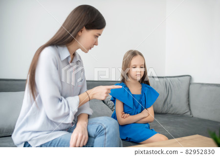 Mother and daughter ahving a conflict and looking stressed 82952830