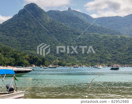Clear and green waters on tropical beach at Ilha Grande, Rio de Janeiro, Brazil 82952980