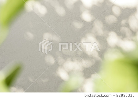Leaves natural shadow bokeh overlay on white texture background, for product presentation, backdrop and mockup, summer seasonal concept, minimal trend style. 82953333