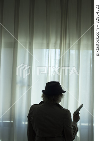 Pistol gun on table in room 82954323