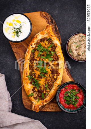 Traditional Turkish pide with meat Traditional Turkish pide with meat 82955065