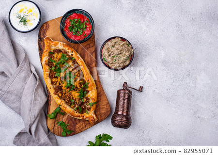 Traditional Turkish pide with meat Traditional Turkish pide with meat 82955071