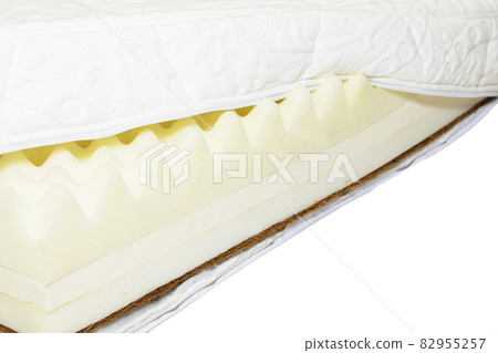 White sponge mattress material close-up. Inside the mattress 82955257