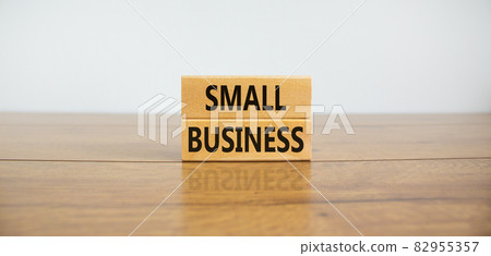 Small business symbol. Wooden blocks form the words 'small business' on beautiful wooden table, white background. Business, small business concept. Copy space. 82955357