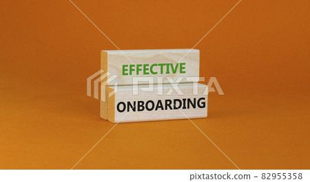 Effective onboarding symbol. Wooden blocks with words Effective onboarding on beautiful orange background. Business, HR and effective onboarding concept. Copy space. 82955358