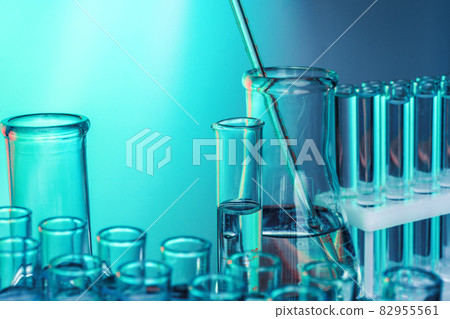 Laboratory chemistry glassware on green toned background 82955561