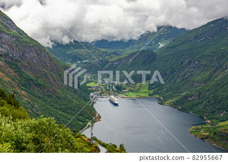View over Geiranger fjord and Seven Sisters waterfall from Ornesvingen-Eagle view point in summer View over Geiranger fjord and Seven Sisters waterfall from Ornesvingen-Eagle view point in summer 82955667