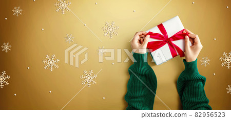 Person making a Christmas gift box Person making a Christmas gift box 82956523