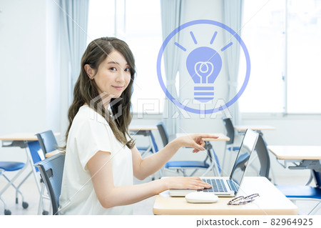 Young woman pointing at a laptop Photo cooperation: Japanese language school attached to Chuo College of Technology Young woman pointing at a laptop Photo cooperation: Japanese language school attached to Chuo College of Technology 82964925