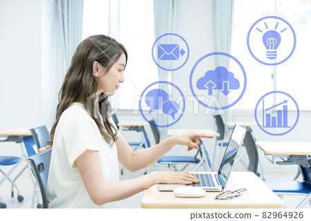 Young woman pointing at a laptop Photo cooperation: Japanese language school attached to Chuo College of Technology Young woman pointing at a laptop Photo cooperation: Japanese language school attached to Chuo College of Technology 82964926