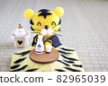 Wool felt tiger relaxing with a kotatsu 82965039