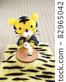 Wool felt tiger pouring liquor with a kotatsu 82965042