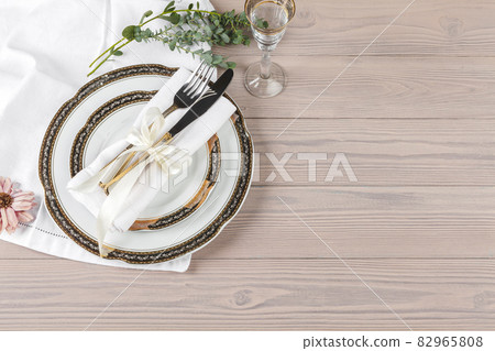 Beautiful rustic table setting on wooden table Beautiful rustic table setting on wooden table 82965808