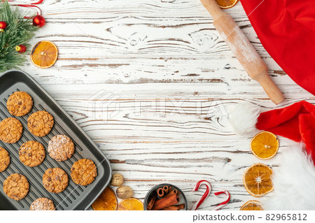 Top view of oat cookies in baking tray on wooden table 82965812