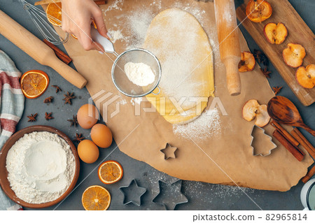 Woman's hands preparing dough for cookies close up 82965814