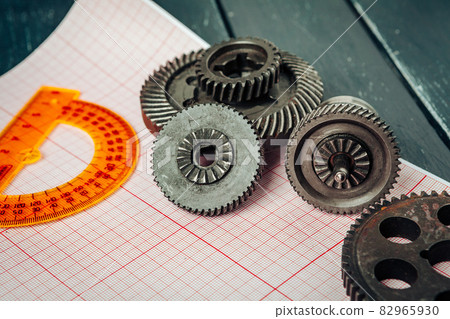 Car parts on graph paper close up. Engineering concept 82965930
