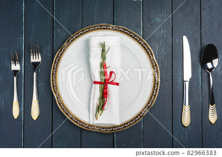 Elegant table setting with festive decor on wooden background Elegant table setting with festive decor on wooden background 82966383