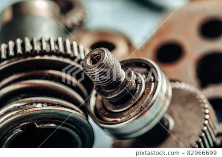 Close up of old rusty car parts on dark background Close up of old rusty car parts on dark background 82966699