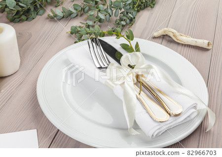 Beautiful table setting on wooden table from above 82966703