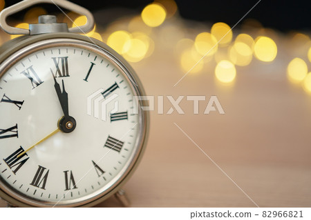 Close up of retro alarm clock on blurred Christmas background with bokeh 82966821