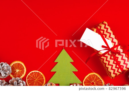 Craft christmas gifts with red ribbons on decorated christmas background 82967396