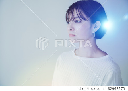 Refreshing image graphics of a woman relaxing in a white space 82968573