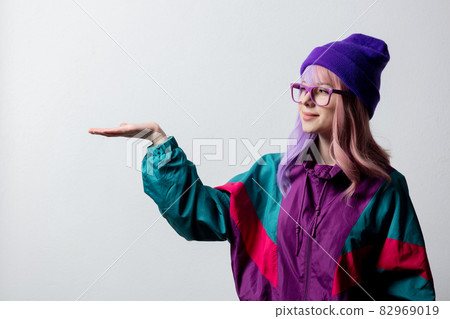 Beautiful woman in glasses and 80s sportsuit Beautiful woman in glasses and 80s sportsuit 82969019