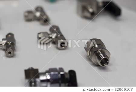 Industrial metal pipe connectors, adapters ; engineering backgound Industrial metal pipe connectors, adapters ; engineering backgound 82969167