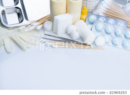 Wound care dressing set. Medical supply for diabetes, surgical and accidental wounds care. Medical equipment for nurse. Forceps, cotton stick, conform bandage, povidone-iodine bottle and latex gloves. 82969263