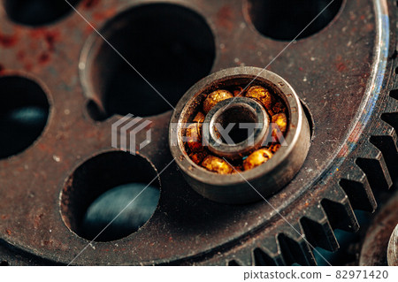 Close up of old rusty car parts on dark background Close up of old rusty car parts on dark background 82971420