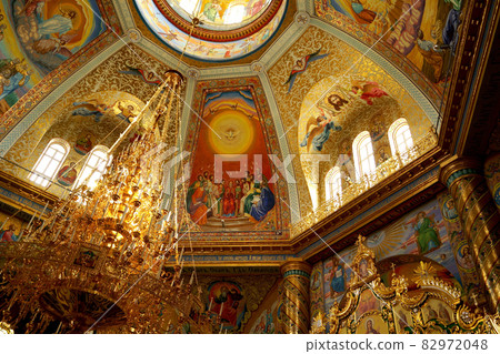 POCHAIV, UKRAINE -2021: Lavra Orthodox Christian Monastery Complex Transfiguration Cathedral Interior Cupola Ceiling Fresco of God Jesus Christ 82972048