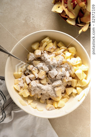 Cutted and peeled apples. Cooking an apple pie or tart. Step by step recipe. 82972109