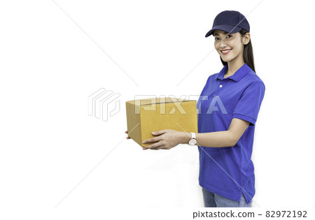 Portrait of happy delivery asian woman her hands holding cardboard box isolated on white background, young asian woman carry brown box sending delivery service concept Portrait of happy delivery asian woman her hands holding cardboard box isolated on white background, young asian woman carry brown box sending delivery service concept 82972192