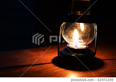There is a candle lamp in the dark There is a candle lamp in the dark 82972289