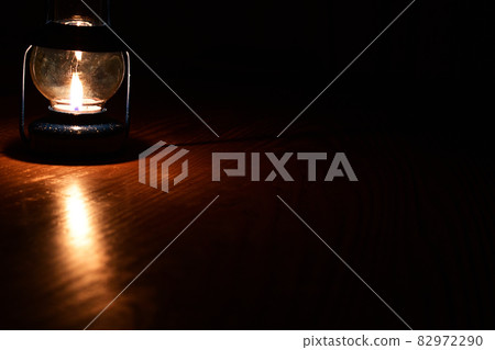 There is a candle lamp in the dark There is a candle lamp in the dark 82972290
