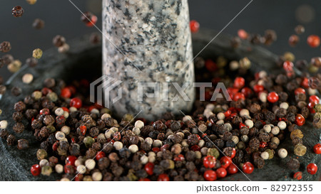 Freeze Motion Shot of Crushing Colored Peppers Balls 82972355