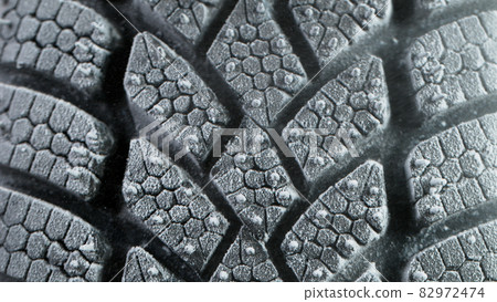 Freeze Motion of Car Tire with Icing and Falling Snow. Freeze Motion of Car Tire with Icing and Falling Snow. 82972474