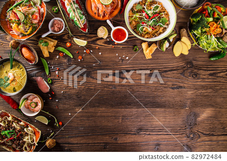 Various of asian meals on rustic wooden background , top view , place for text. Various of asian meals on rustic wooden background , top view , place for text. 82972484