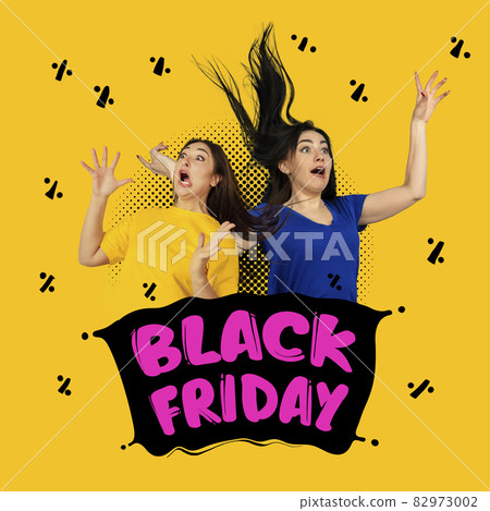 Two surprised shocked women shouting on yellow backgound. Human emotions, black friday, cyber monday, purchases, sales concept. Two surprised shocked women shouting on yellow backgound. Human emotions, black friday, cyber monday, purchases, sales concept. 82973002