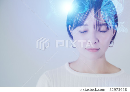 Refreshing image graphics of a woman relaxing in a white space 82973638