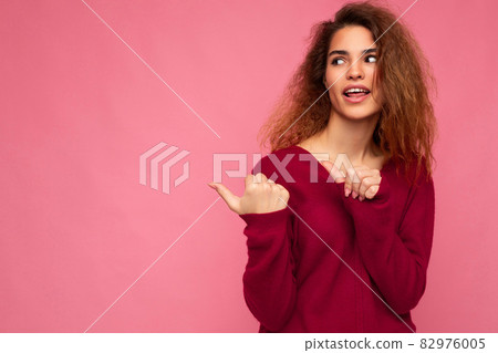Photo of young happy positive beautiful brunette wavy woman with sincere emotions wearing casual Photo of young happy positive beautiful brunette wavy woman with sincere emotions wearing casual 82976005