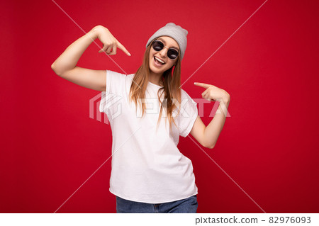 Portrait of young emotional positive happy joyful beautiful dark blonde woman with sincere emotions 82976093